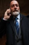 Businessman Looking In Front Of Camera Stock Photo