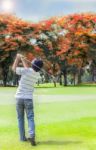 Male Golf Player Teeing Off Golf Ball Stock Photo