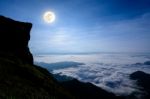 Full Moon On The Peak Mountain Stock Photo