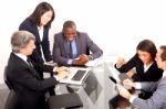 Multi Ethnic Team During Meeting Stock Photo