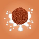 Chocolate Ball Splash Milk Stock Photo