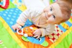 Infant Boy On Playmat Stock Photo