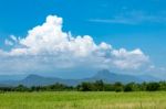 Trees And Mountains On A Bright Sky Stock Photo