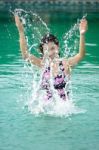 The Woman Relaxing In The Swimming Pool Stock Photo