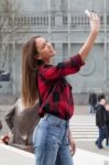 Young Brunette With A Smart Phone Stock Photo