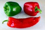 Close-up Macro Shot Of Red And Green Capiscums And A Cayenne Pep Stock Photo