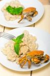 Italian Gnocchi With Seafood Sauce With Crab And Basil Stock Photo