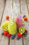 Fresh Blended Fruit Smoothies In Vintage Milk Bottles Stock Photo