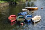 Group Of Rowing Boats Full With Rainwater Stock Photo