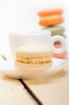 Colorful Macaroons With Espresso Coffee Stock Photo