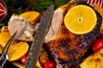 Christmas Baked Duck Served With Potatoes, Orange And Tomatoes Stock Photo