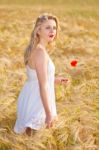 Portrait Of Beautiful Girl In Field Stock Photo