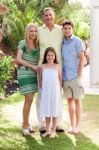 A Family Standing Together Stock Photo