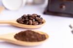 Wooden Spoons Filled With Crushed Ground Coffee On White Backgro Stock Photo