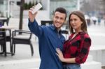 Young Couple Using Smart Phone Stock Photo