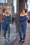 Pretty Young Girl Standing At Shopfront Stock Photo