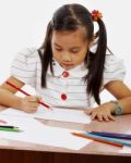 Young Girl Drawing Picture Stock Photo