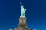 Statue Of Liberty On Clear Blue Sky Stock Photo