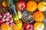 Bottle Of Juice On  Fruits Stock Photo