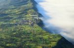 Village And Cliff At Bromo Volcano Mountain Stock Photo