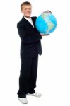 Young Kid Holding Globe Stock Photo