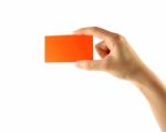 Hand And Orange Card Stock Photo