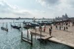 Gondolas Moored At The Entrance To The Grand Canal Stock Photo