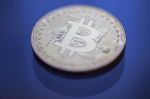 Bitcoin Curency Dof On Blue Light Background Stock Photo