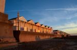 A Row Of Brightly Coloured Beach Huts In Southwold Stock Photo