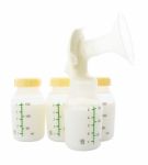 Breast Pump And Milk Bottle Stock On White Background Stock Photo