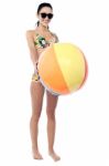 Smiling Woman In Bikini Holding A Beach Ball Stock Photo