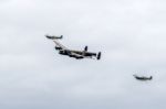 Avro Lancaster Flanked By Two Spitfires Stock Photo