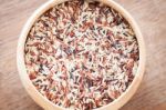 Organic Dry Multi Grain Rice In Wooden Bowl Stock Photo