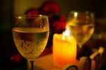 Two Glasses Of Champagne With A Christmas Decor In The Background Stock Photo