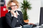 Lady Attending Clients Call Stock Photo