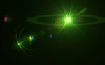 Green Digital Lens Flare In Black Background Horizontal Frame Wa Stock Photo