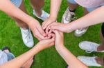 Five Arms With Hands Of Children Entangled Stock Photo