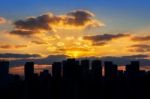 Building's Silhouettes Of A City And Sunset Stock Photo