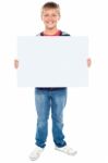 Young Boy Holding Blank Board Stock Photo