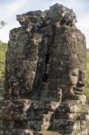 Ancient Stone Faces Of King Jayavarman Vii At The Bayon Temple, Stock Photo