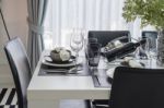 Black And White Modern Dinning Table With Table Set Stock Photo