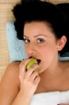 Smiling Woman Eating Apple Stock Photo