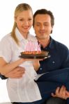 Couple Celebrating Birthday With Cake Stock Photo