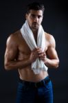 Beautiful And Muscular Man In Dark Background Stock Photo