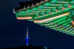 Namsangol Hannok Village And Seoul Tower Located On Namsan Mountain At Night In Seoul,south Korea Stock Photo