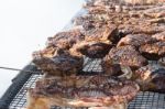 Traditional Meat Grilled On The Grill In The Argentine Countryside Stock Photo