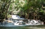 The Water Flowing Over Rocks And Trees Down A Waterfall At Huay Mae Khamin Waterfall National Park ,kanchana Buri In Thailand Stock Photo