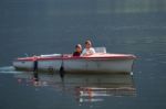 Two People In A Speedboat On Lake Hallstatt Stock Photo