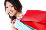 Cheerful Young Shopaholic Girl Stock Photo