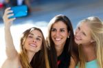 Group Of Friends Taking Selfie In The Street Stock Photo